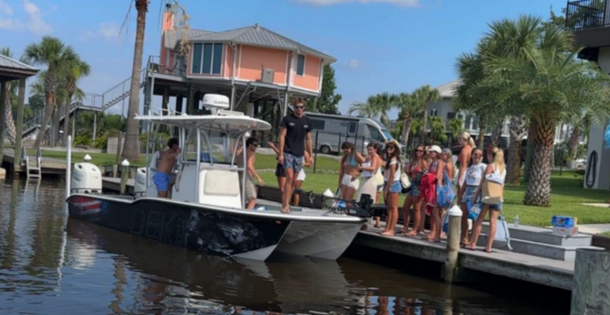 A large group of friends, including Nolan Xavier Wells, traveled on three boats to Horn Island on July 4, 2026. Pictured here is the large group of friends getting ready to get on the boats to head to the island.
